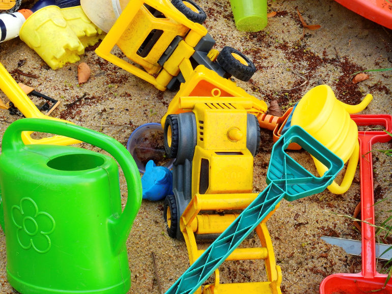 plastic toys in sand