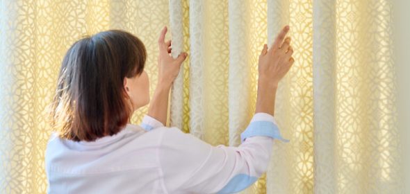 Woman about to wash velvet curtains