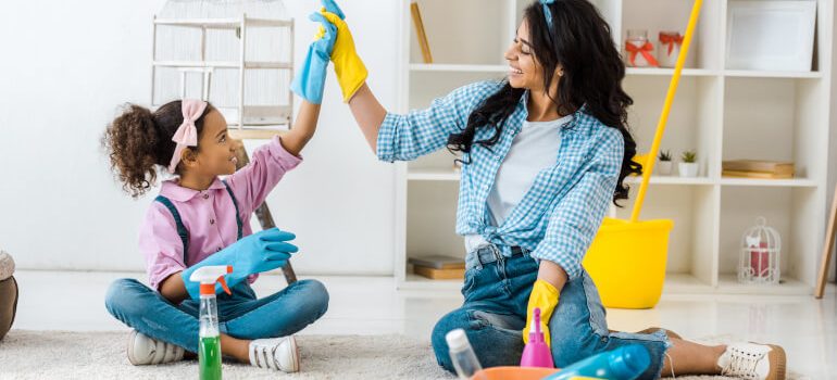 Mother and daugther spring cleaning the house